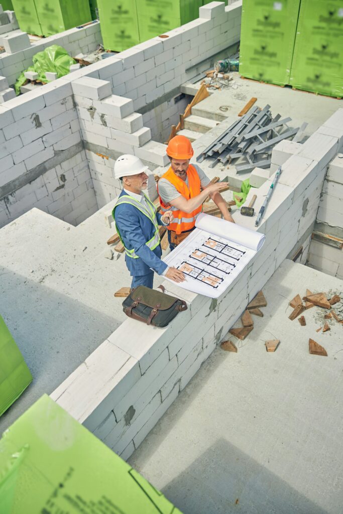 Structural engineer inspecting residential foundation and framing for safety and code compliance in Colorado.